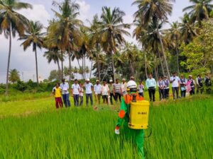 Students demonstrating plant protection kit as part of Agricultural Engineering interventions in Agriculture